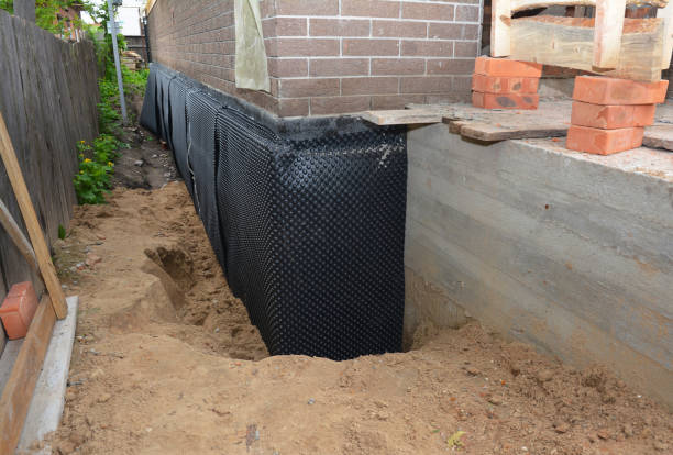 Happy homeowners after waterproofing job in Kimmell